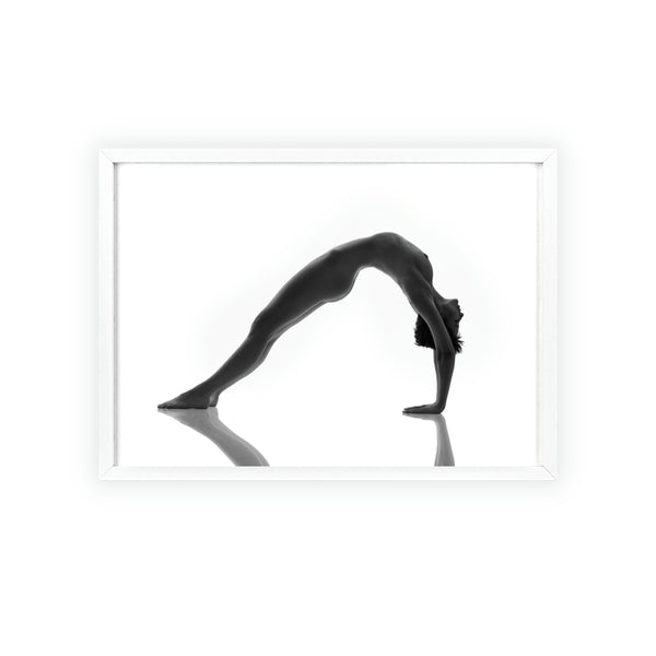Woman doing yoga pose in white against white background