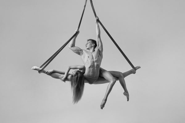 Couple, acrobats, hanging, silk, aesthetically breathtaking, fit bodies, artistic, sexy. black and white photo print. 